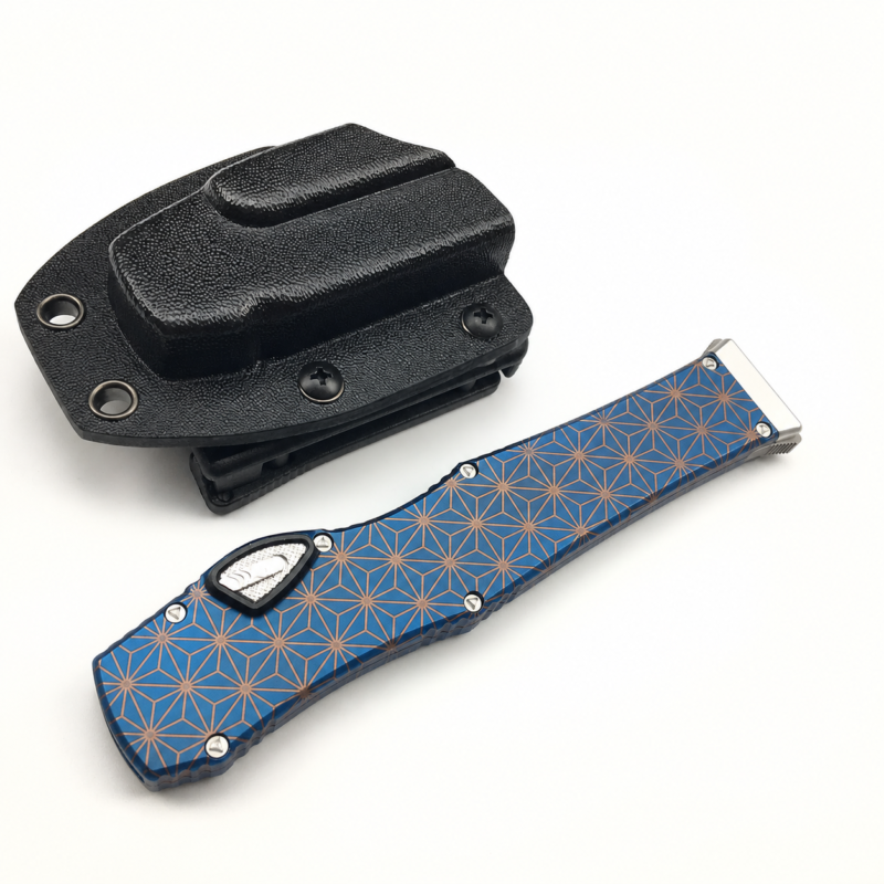 Cerulean Copper Asanoha aluminum alloy OTF automatic knife closed beside a black sheath on white