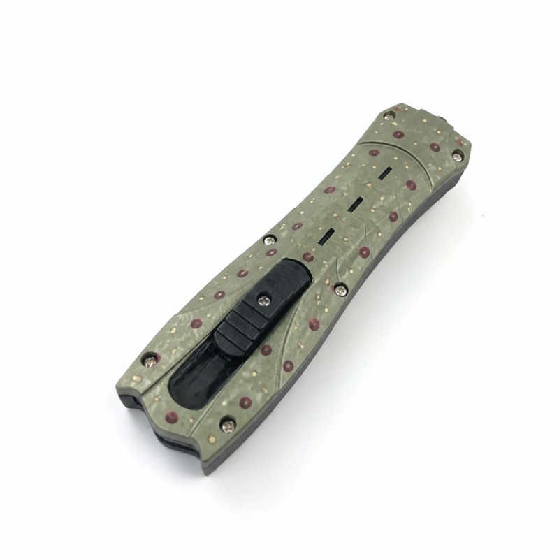 Pearl Moss Pomegranate Seed sculpted-handle OTF automatic knife shown closed on white