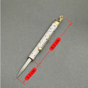Ivory Cobalt Terrazzo pen-style OTF automatic knife with cylindrical housing and side button