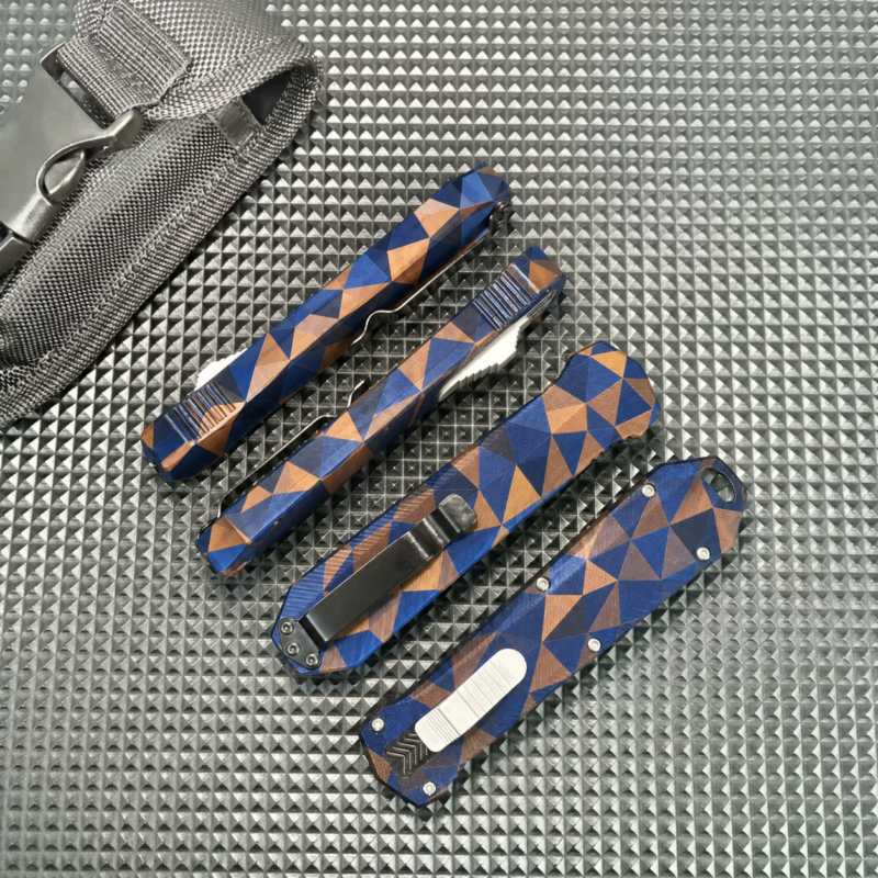 Cobalt Copper Angular Tessellation OTF automatic knife with face slider and hooked tail opening