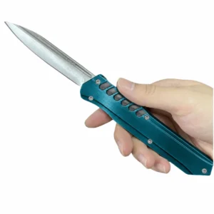 Midnight teal vented large OTF knife with double-edge twin-fuller blade and tapered handle