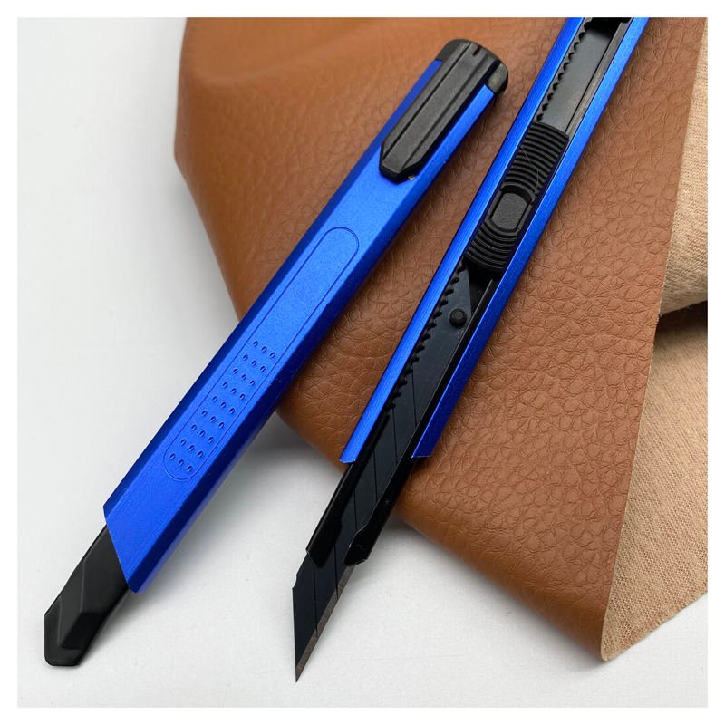 Blue9mm framed utility knives showing sliding blade channel and rear clip