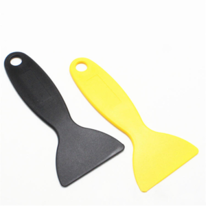 Yellow and black flat plastic scrapers with fan-shaped working edges and hanging holes