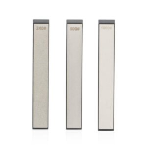 Three narrow diamond sharpening strips with dark backings and240, 600 and 1000 grit markings